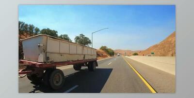 Passing a double trailer freightliner truck on a highway in slow motion (Videohive 45911552)